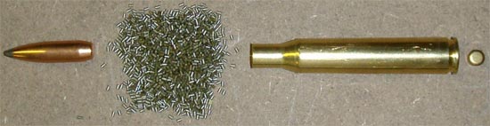 Унитарный патрон с металлической гильзой в разборе. Слева направо: 1. пуля; 2. пороховой заряд; 3. гильза; 4. капсюль.