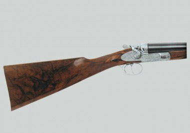 Современное курковое ружье Beretta Diana высокого класса декорировано в фирменном стиле гравировкой с углубленным фоном